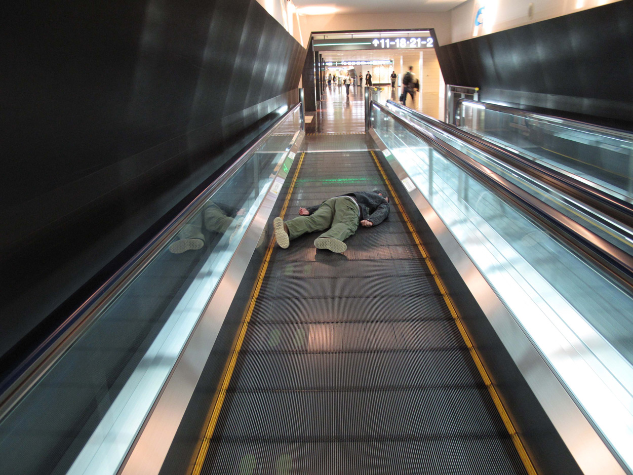 Clown Throwing Pie On Escalator