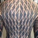miniature pour Un homme avec un tatouage sur tout le corps
